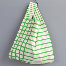 画像をギャラリービューアに読み込む, 作家オリジナル生地でつくった手持ちタイプのアシメフリルバッグ|takutomo(タクトモ)