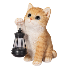 画像をギャラリービューアに読み込む, ソーラーランプを右手で持ち上げる茶トラ猫|WooBia(ウービア)