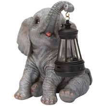 画像をギャラリービューアに読み込む, ソーラーランプを鼻で持ち上げる赤ちゃんゾウ｜WooBia（ウービア）
