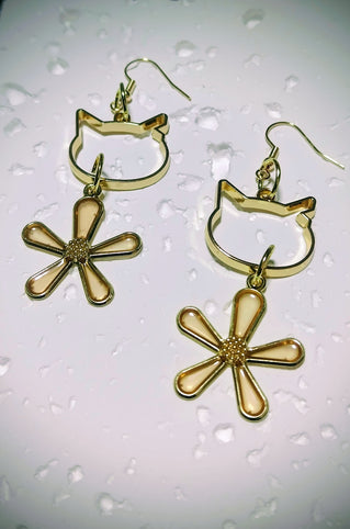 mimine 猫耳カットと透き通るオレンジの花モチーフピアス｜mimine（ミミンヌ）